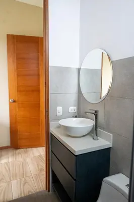 a bathroom with a sink and a mirror at Casa Cieneguilla in Cieneguilla