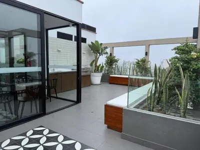 a balcony of a house with plants on it at Barranco Bohemio, Modern and Bright Apartment in Lima