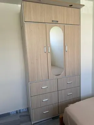 a dresser with a mirror in a bedroom at Habitacion San Borja in Lima