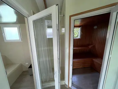 a glass door leading to a sauna in a house at Hermosa Casa de Campo en Azpitia in Santa Cruz de Flores
