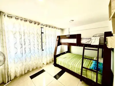 a bedroom with two bunk beds and a window at Comfort House in Lima