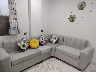 a couch in a living room with pillows on it at Ocean Glips II in Punta Negra
