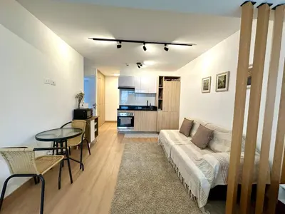 a living room with a couch and a table at Mini Patria - Cozy apartment in Barranco in Lima