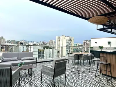 a rooftop patio with a view of a city at Mini Patria - Cozy apartment in Barranco in Lima