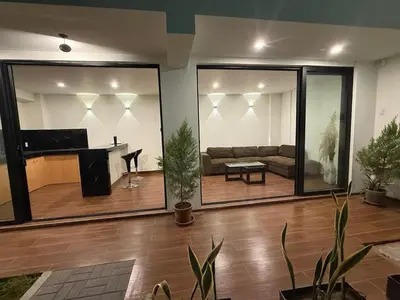a living room with a couch and a piano at Casa LeBlanc in Ica