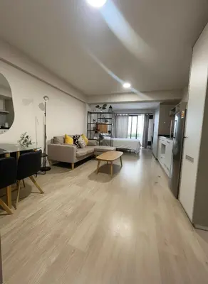 a living room with a couch and a table at E Free Parking Patio Privado Barranco 1B 109 in Lima