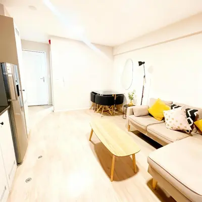a living room with a couch and a piano at E Free Parking Patio Privado Barranco 1B 109 in Lima