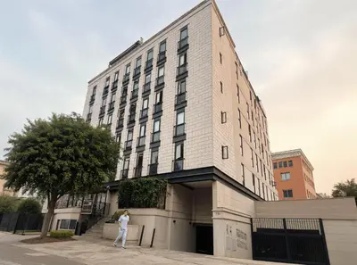 a person standing in front of a building at E Free Parking Patio Privado Barranco 1B 109 in Lima