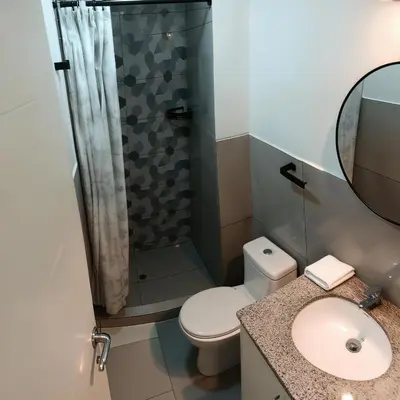 a bathroom with a toilet and a shower at E Free Parking Wifi Pro Laundry 1B 204 in Lima