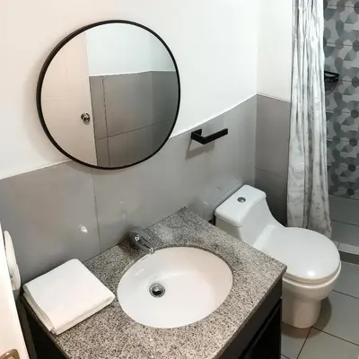 a bathroom with a sink and a mirror at E Free Parking Wifi Pro Laundry 1B 204 in Lima