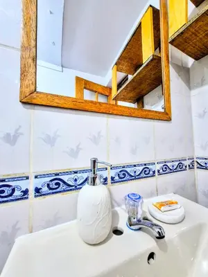 a bathroom with a sink and a mirror at Loft Rústico 03 en Valle Sagrado in Urubamba