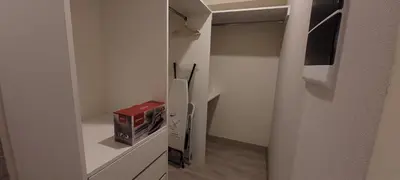 a small kitchen with a refrigerator and a microwave at Loft de Luxe - cerca a San Borja & San Isidro in Lima