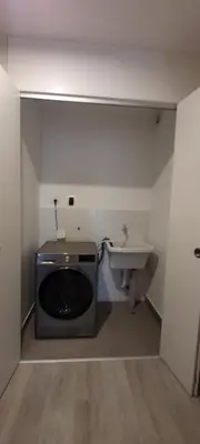 a bathroom with a sink and a microwave at Loft de Luxe - cerca a San Borja & San Isidro in Lima