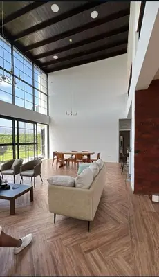 a living room with a couch and a table at Hermosa casa con piscina privada in Asia