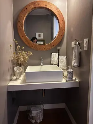 a bathroom with a white sink and a mirror at Huaca Pucllana Design Apartment between Miraflores and San Isidro in Lima