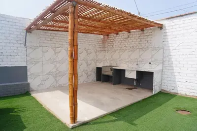 a pavilion with a desk in a white brick wall at Departamento cerca a la playa 202 in Punta Negra