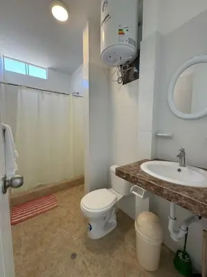 a bathroom with a toilet and a sink at Departamento cerca a la playa 202 in Punta Negra