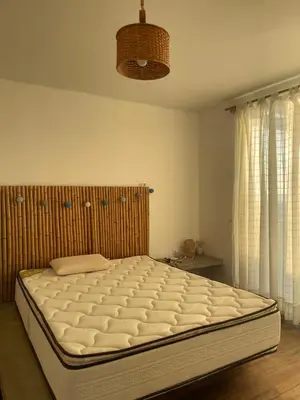 a bed in a bedroom with a large mattress at Refugio 55 Casa de Playa en Chincha, Frente al mar in Chincha Baja