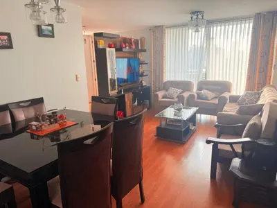 a living room with a couch and a table at Casa Lima Brasil in Lima