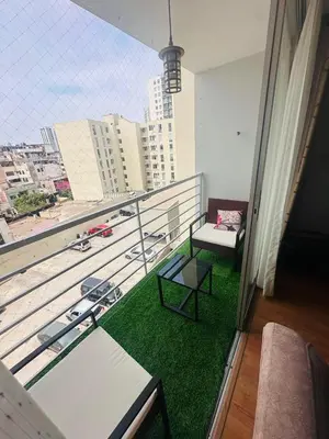 a room with a balcony with a table and a bench at Casa Lima Brasil in Lima