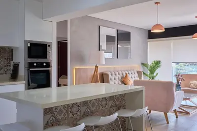a kitchen with a large white island in a room at Barranco Bright apartment with Balcony in Lima