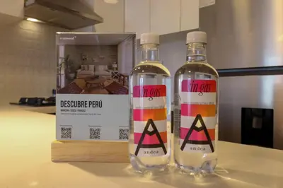 two bottles of vodka sitting on a counter next to a box at Marvelous 2BR with Balcony in Miraflores in Lima