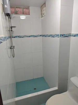 a bathroom with a shower and a toilet at Oxapampa Center Room- habitacion centro in Oxapampa