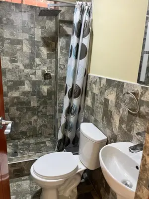 a bathroom with a toilet and a sink at La Finca de la Norteñita 1926 in Santa Rosa de Quives