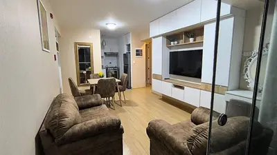 a living room with a couch and a dining room at Pueblo Libre 501 in Lima