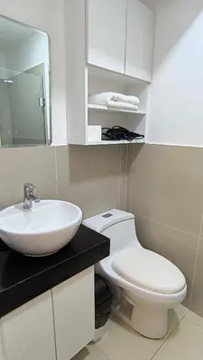 a bathroom with a white toilet and a sink at Pueblo Libre 501 in Lima