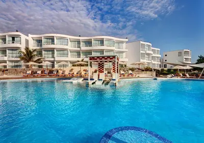 a large swimming pool in front of a hotel at VPX Hotel in Asia