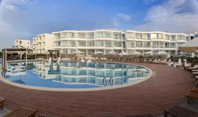 a large building with a swimming pool in front of it at VPX Hotel in Asia