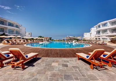 a swimming pool with lounge chairs and a resort at VPX Hotel in Asia