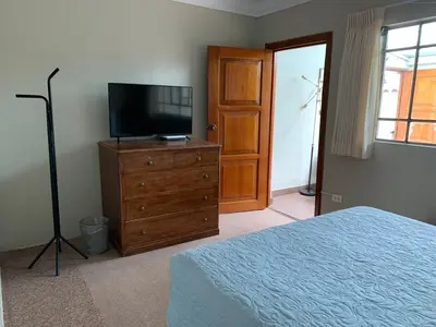 a bedroom with a bed and a television on a dresser at Full Mini Apartment for 2 in Cusco
