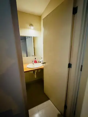 a bathroom with a sink and a mirror at Kira House in Lima