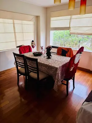 a dining room with a table and chairs and a window at Kira House in Lima