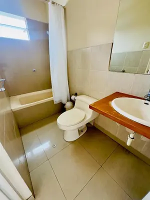 a bathroom with a toilet and a sink at Kira House in Lima