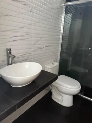 a bathroom with a sink and a toilet at San Borja Room Baño Compartido in Lima