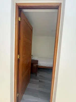 an open door to a bedroom with a bed at San Borja Room Baño Compartido in Lima
