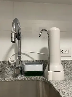 a kitchen counter with a sink with a faucet at Acogedor Departamento en Centro Histórico de Cusco in Cusco
