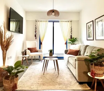 a living room with a couch and a table at Acogedor Departamento en Centro Histórico de Cusco in Cusco