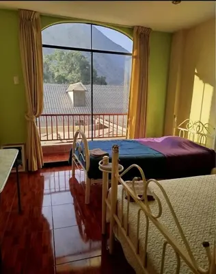a bedroom with a bed and a large window at Large quiet apartment in condominium in Santa Eulalia