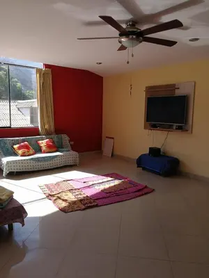 a living room with a couch and a flat screen tv at Large quiet apartment in condominium in Santa Eulalia