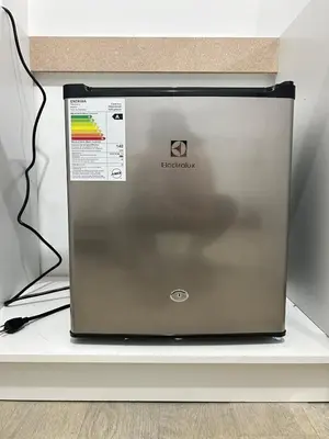 a laptop computer sitting on top of a shelf at Departamento de un solo ambiente in Lima