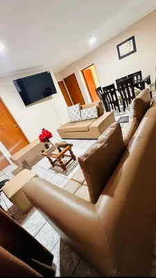 a living room with a couch and a table at DEPARTAMENTO Chincha City 1 in Chincha
