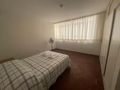a small bedroom with a bed and a window at Departamento independiente en Santa Catalina in Lima