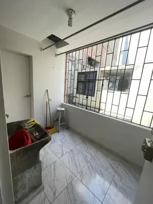 an empty room with a large window and a tub at Departamento independiente en Santa Catalina in Lima