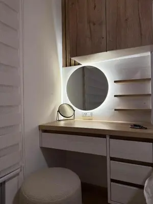 a bathroom with a vanity with a mirror and a stool at Departamento de Estreno en Zona Financiera in Lima