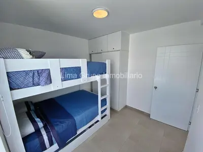a bedroom with two bunk beds in a room at Duplex Condominio Míkonos Asia in Asia