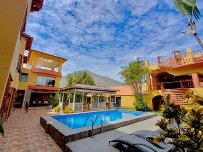 an image of a house with a swimming pool at Hostal Sol Y Luna - Cieneguilla in Cieneguilla